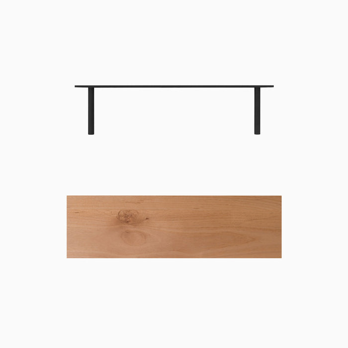 A minimalist Aksel Alder Floating Shelf with natural wood and black metal brackets for stylish wall display and organization.