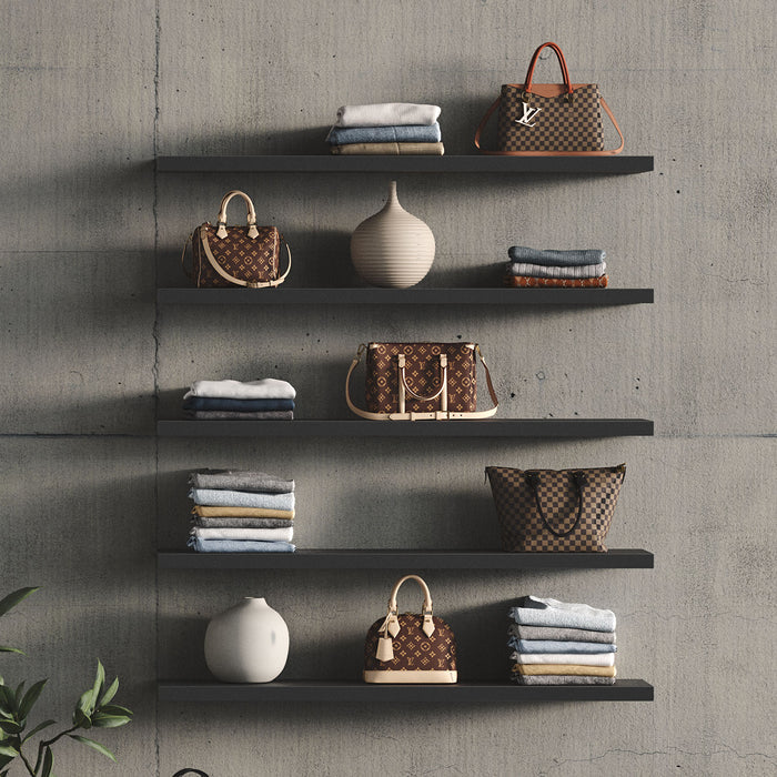 Aksel Black Floating Shelf displaying handbags, folded clothes, and decorative vases for organized, stylish wall display.