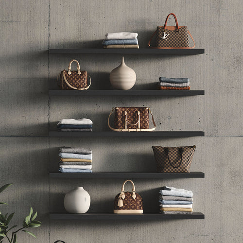 Aksel Black Floating Shelf displaying handbags, folded clothes, and decorative vases for organized, stylish wall display.