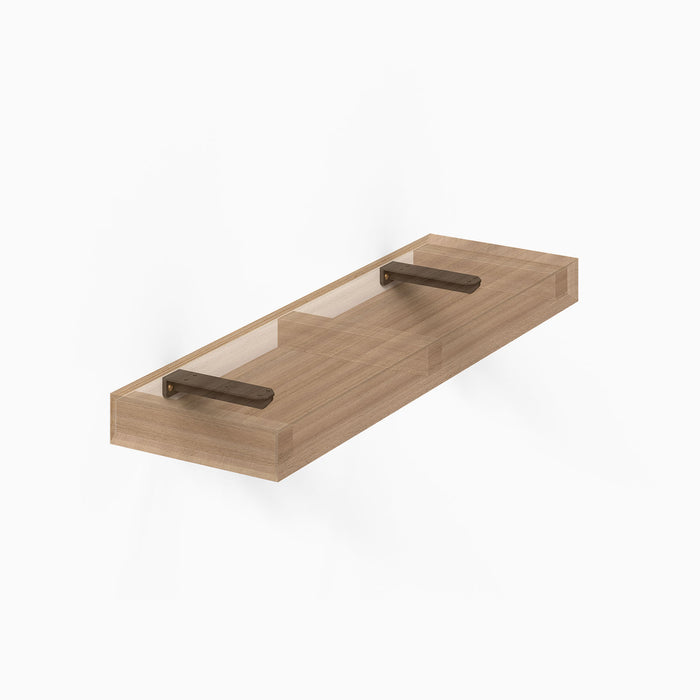 Aksel Hollow Core Single Rod Floating Shelf Bracket in matte black steel supporting a wood floating shelf core