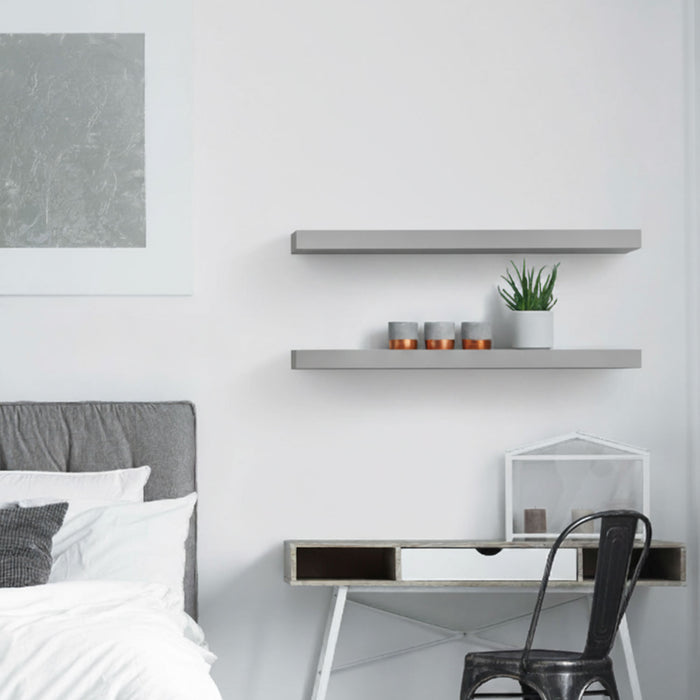 Aksel Inlay Arsenic Floating Shelf in arsenic tone with sleek floating shelf brackets holding small decor items in minimalist room