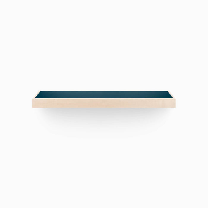 A minimalist Aksel Inlay Maple Floating Shelf with a dark inlay, perfect for stylish wall display and organization.
