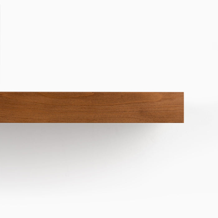 Aksel Inlay Nutmeg Floating Shelf made of warm wood floating against a white wall for minimalist display and organization.
