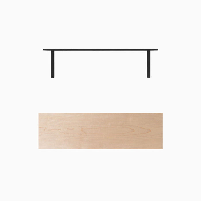 Aksel Maple Floating Shelf with sleek black metal brackets and a smooth, light maple wood surface for minimalist wall display