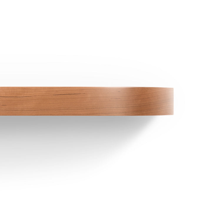 Aksel RADius Cherry Floating Shelf close-up showing smooth rounded edge with warm cherry hardwood finish by Shelfology