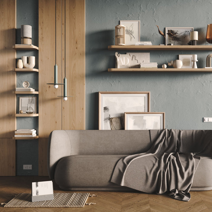 Aksel RADius Cherry Floating Shelf with smooth rounded edges displaying decorative items on textured gray wall by Shelfology