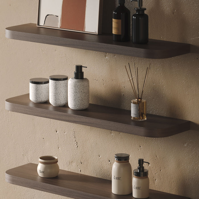 Aksel RADius Walnut Floating Shelf with smooth rounded edges displaying bathroom essentials on warm textured wall