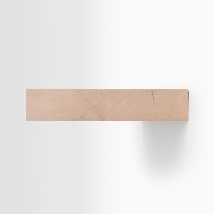 Aksel Unfinished Alder Floating Shelf showing natural wood grain with minimalist design for wall display and organization.