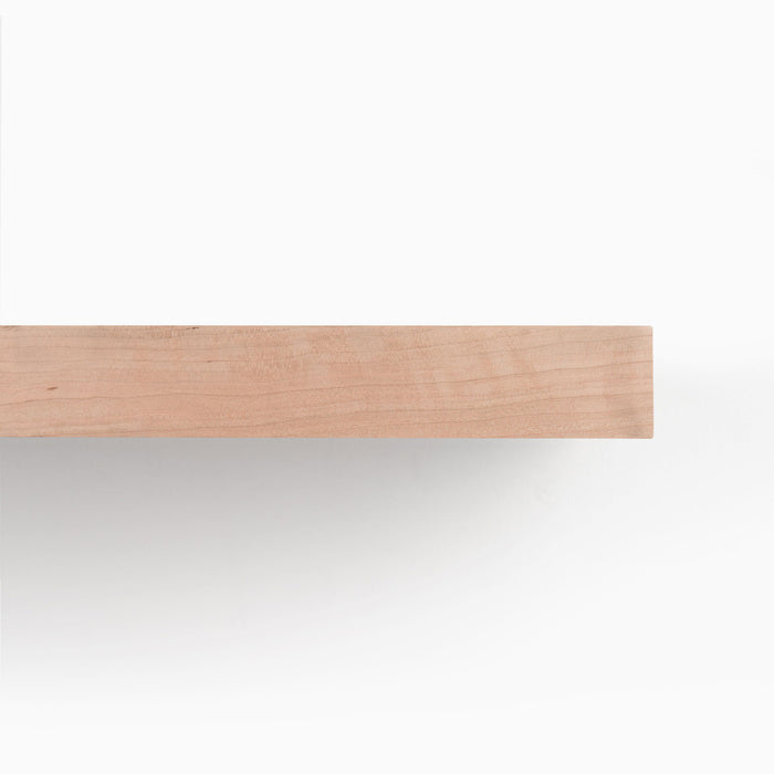 Aksel Unfinished Cherry Floating Shelf showcasing clean, minimalist wood floating shelf design for functional wall display.