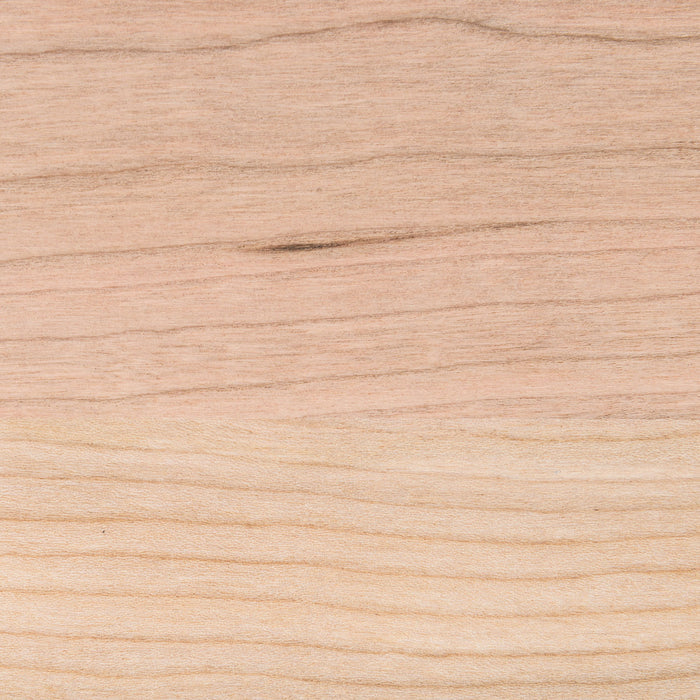 Close-up of the natural wood grain texture on the Aksel Unfinished Cherry Floating Shelf by Shelfology.