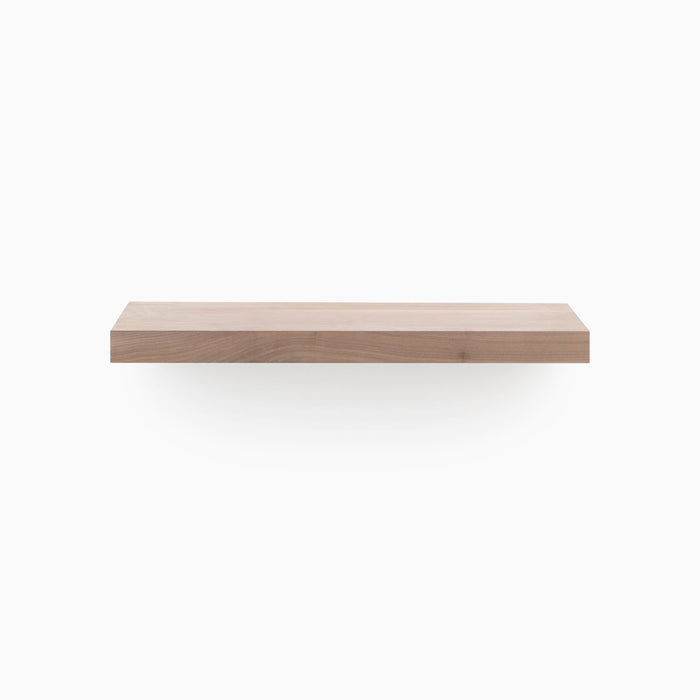 A minimalist Aksel Unfinished Walnut Floating Shelf showcasing wood floating shelves for stylish wall display and organization.