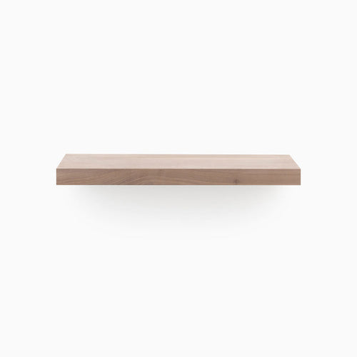 A minimalist Aksel Unfinished Walnut Floating Shelf showcasing wood floating shelves for stylish wall display and organization.