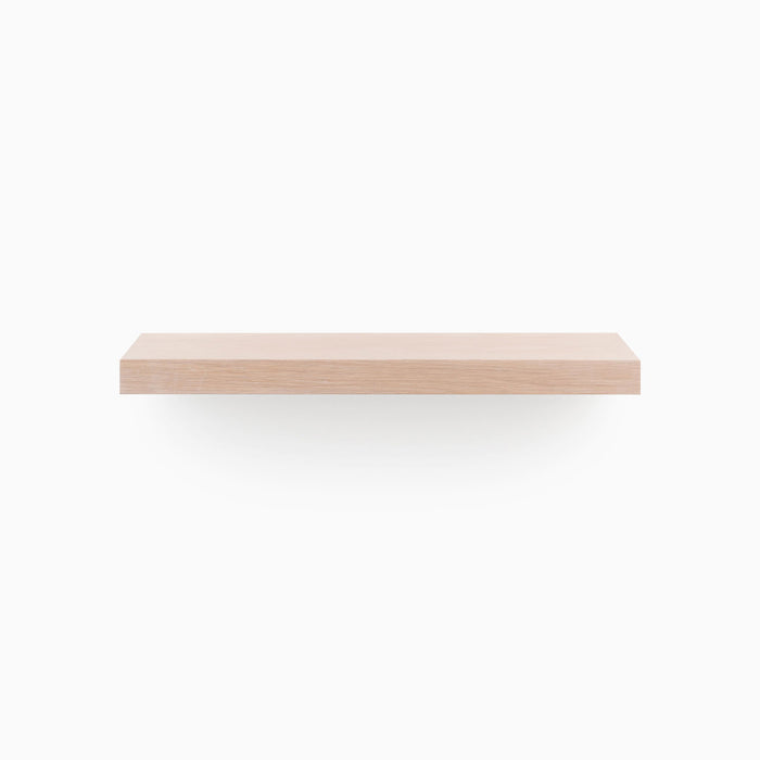 A minimalist Aksel Unfinished White Oak Floating Shelf designed for functional wall display and organization by Shelfology.