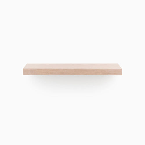 A minimalist Aksel Unfinished White Oak Floating Shelf designed for functional wall display and organization by Shelfology.