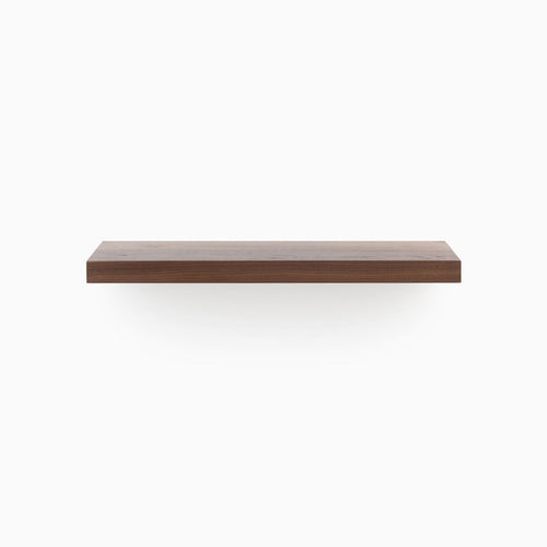 Aksel walnut floating shelf crafted from solid wood with a sleek, minimalist profile, front view