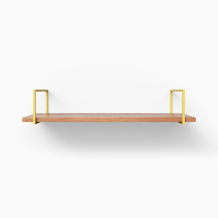 Bart Cherry Wall Shelf with warm cherry wood and sleek brass metal floating shelf brackets for refined wall organization