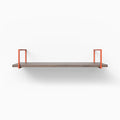 Bart Hatch Grey Wall Shelf with smooth textured grey wood and vibrant orange metal floating shelf brackets for modern display