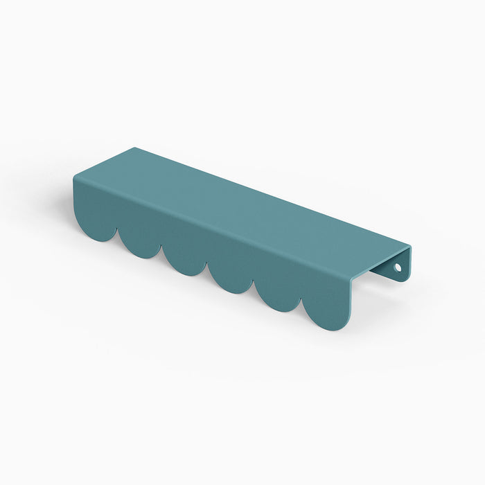 Bubble Cabinet Pull in muted blue with scalloped edges providing playful charm and practical cabinet hardware function