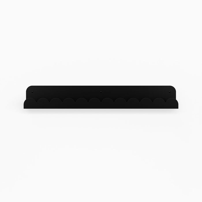 Bubble Picture Ledge in black matte steel with scalloped edge designed for stylish wall display and organization
