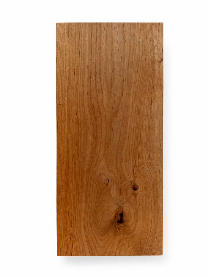 Clearance — Aksel Black Floating Shelf — 22" Length x 10" Depth x 1.5" Thick in solid hardwood with natural grain and knots, designed for minimalist wall shelving and display ledges.