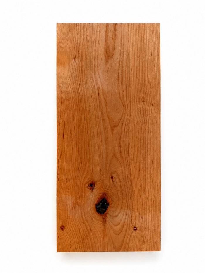 Clearance — Aksel Black Floating Shelf — 22" Length x 10" Depth x 1.5" Thick in warm natural wood tone showcasing solid hardwood craftsmanship for elegant wall shelves and display ledges.