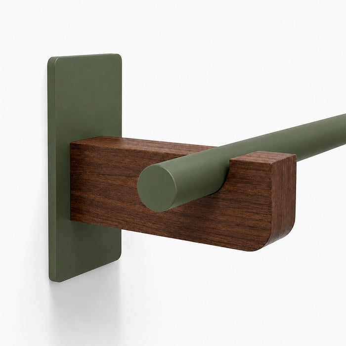 Close-up of the Draper Curtain Rod System showing a matte green metal rod supported by a solid hardwood bracket mounted on a matching green wall plate.