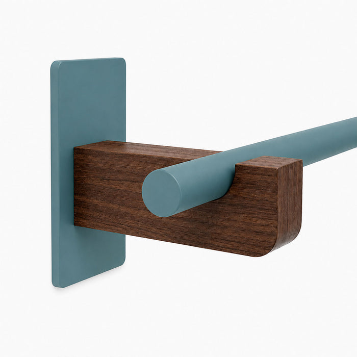 Minimalist Draper Curtain Rod System featuring a mixed-material wood and steel design with functional wall mounting bracket.