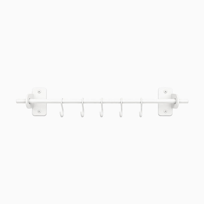 White minimalist Etta Utensil Rack with six hooks designed for organizing kitchen tools, crafted for durability and functional wall storage.