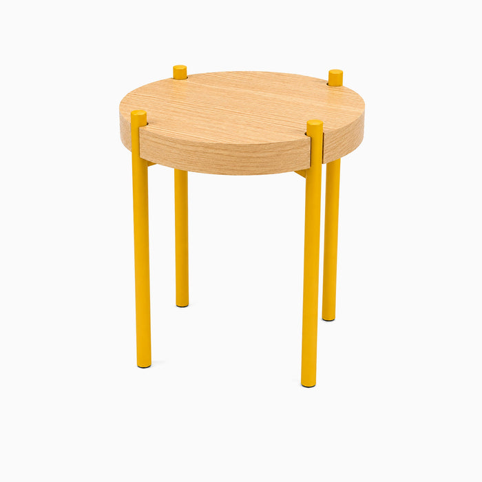 Minimalist Fern Plant Stand (White Oak) with a round hardwood top and bright yellow metal legs, designed for stylish, functional display.