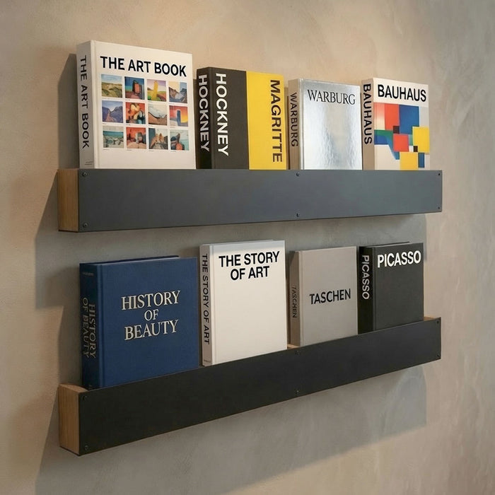 Folio Art Book Display showing minimalist black and wood mixed-material display ledges mounted on a wall holding art books, blending functional organization with stylish decor.