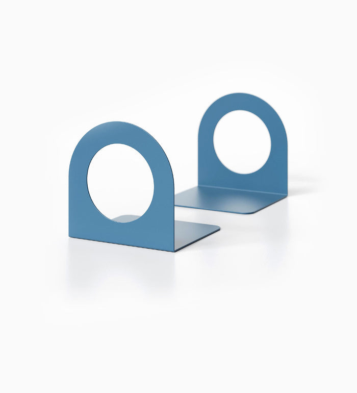 Geo Round Open Bookends (Set of Two) — 7" x 5" x 5 1/2" — Clearance in minimalist blue metal with circular cutout, designed for stylish shelf and wall display organization.