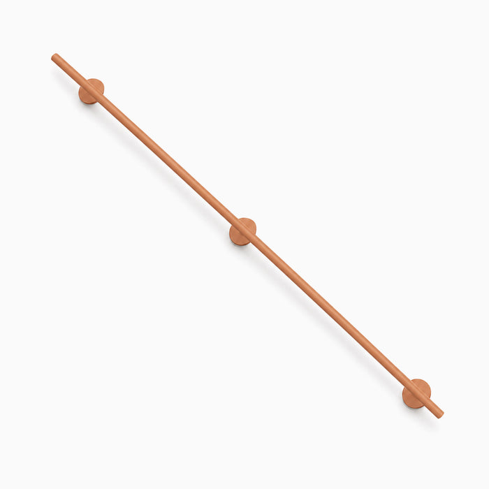 Minimalist wood Grip Stair Rail with smooth cylindrical design and round wall mounts, perfect for functional and stylish wall shelf support.
