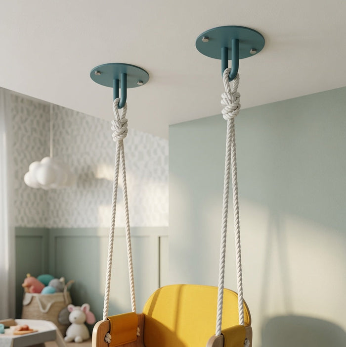 Two teal Hang On Ceiling Hooks securely fasten ropes for a wooden swing in a softly lit, minimalist kids' room with organized decor.