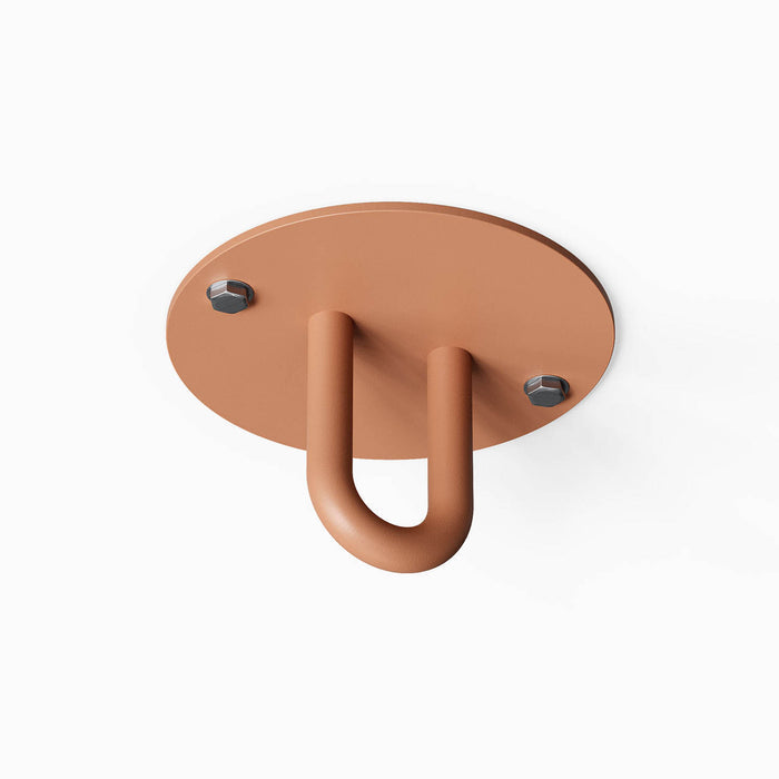 Hang On Ceiling Hook in rust-resistant steel with a minimalist design, ideal for organizing and maximizing wall space in any room.