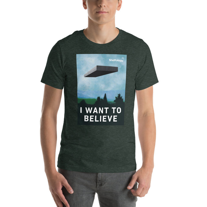 I Want to Believe T-shirt in forest green with floating shelf graphic and bold white text for casual minimalist style