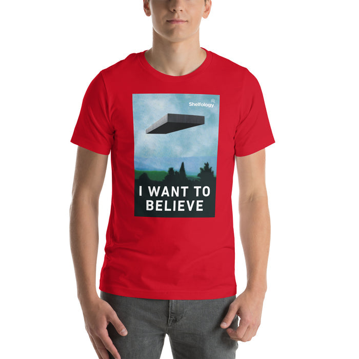 I Want to Believe T-shirt in red featuring a floating shelf graphic with bold text for casual minimalist style