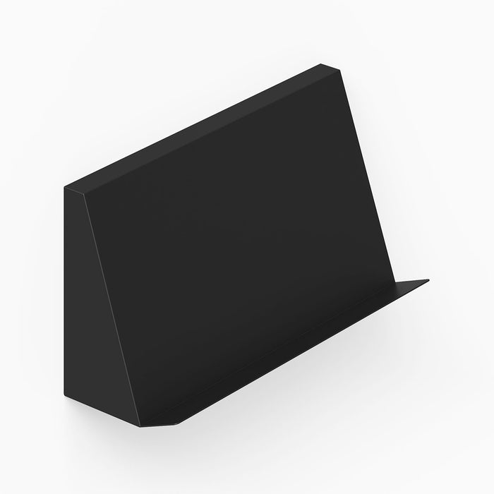 Black minimalist metal wall display with angled front ledge designed for the Issue Book + Magazine Wall Display, ideal for organized spaces.
