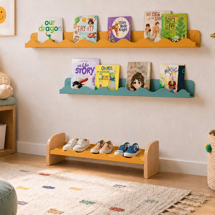 Kiddie Kicks Shoe Rack in natural wood and powder-coated steel with playful wavy edges, supporting small children's shoes in a cozy, organized playroom setting.