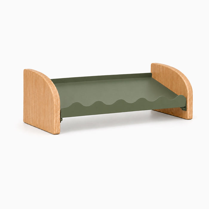 Kiddie Kicks Shoe Rack featuring solid white oak side legs and an army green powder-coated steel shelf for organized, playful kids’ shoe storage.