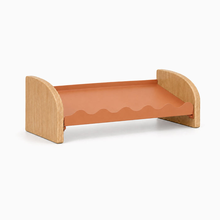 Kiddie Kicks Shoe Rack with solid white oak side legs and a claymore powder-coated steel shelf featuring wavy edges for organizing small children's shoes.
