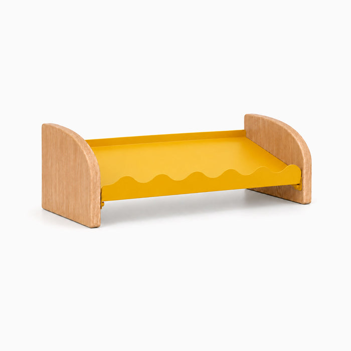Kiddie Kicks Shoe Rack featuring solid white oak side legs and a honey mustard powder-coated steel shelf with playful wave edges for organizing small shoes.