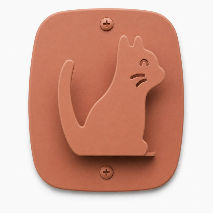 Kiddo Hooks shaped like a playful cat in clay color, made with durable materials perfect for organizing and adding charm to any wall space.