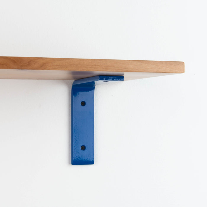 Leif Alder Wall Shelf with solid alder wood and vibrant blue metal floating shelf bracket for functional wall display