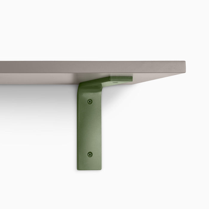 Leif Arsenic Wall Shelf showcasing satin clear alder wood with a wide olive green metal L bracket for sturdy wall display