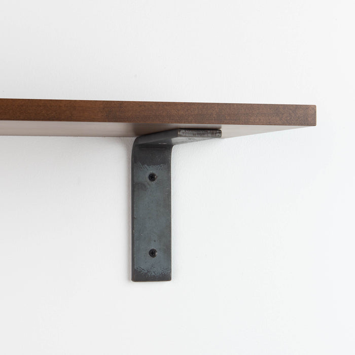 Leif Espresso Wall Shelf featuring solid alder wood with a smooth dark finish and raw steel bracket for modern display