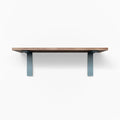 Leif Nutmeg Wall Shelf with solid alder wood in satin clear finish and wide blue metal L brackets for sturdy wall display