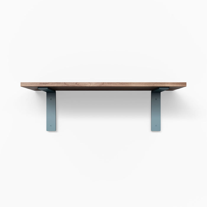Leif Nutmeg Wall Shelf with solid alder wood in satin clear finish and wide blue metal L brackets for sturdy wall display