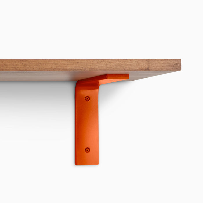 Leif Nutmeg Wall Shelf with satin clear alder wood and bright orange metal L bracket for sturdy wall shelf support