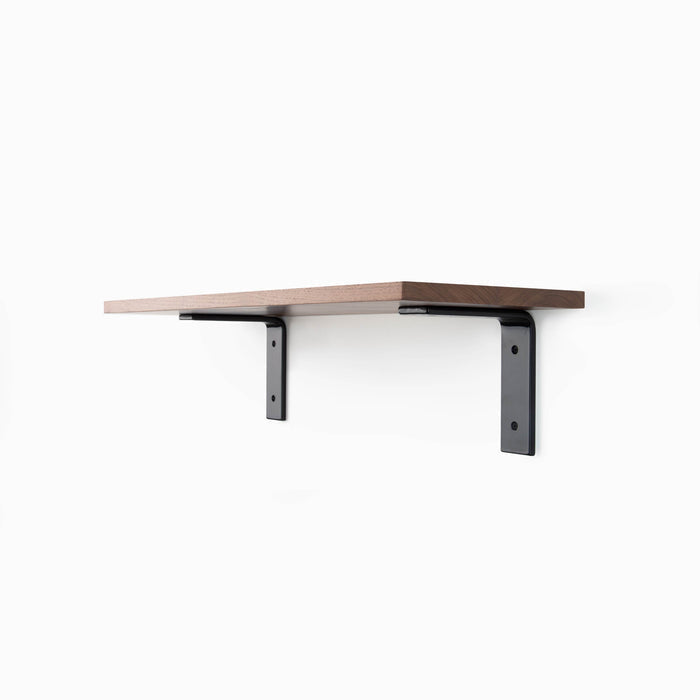 Leif Walnut Wall Shelf with smooth walnut glue-up and matte black metal L brackets for sturdy floating wall shelf display