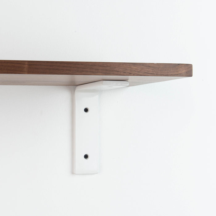 Leif Walnut Wall Shelf with smooth walnut glue-up and white metal L bracket for clean floating shelf support